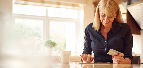 Lady on a tablet with card